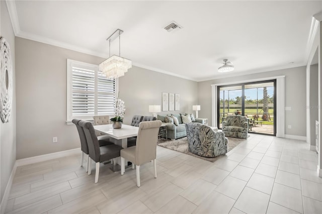13867 Vadini St, Venice, FL 34293 - dining area with crown molding, an inviting chandelier, baseboards, and visible vents
