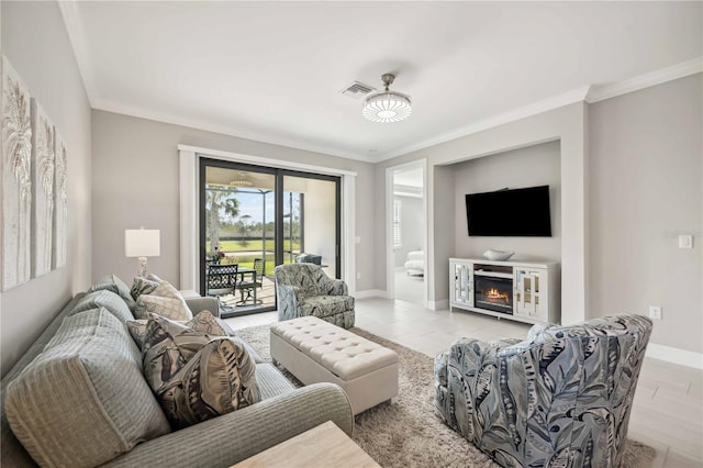 13867 Vadini St, Venice, FL 34293 - living area featuring a lit fireplace, crown molding, baseboards, and visible vents