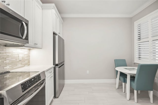 13867 Vadini St, Venice, FL 34293 - kitchen featuring tasteful backsplash, baseboards, appliances with stainless steel finishes, and crown molding