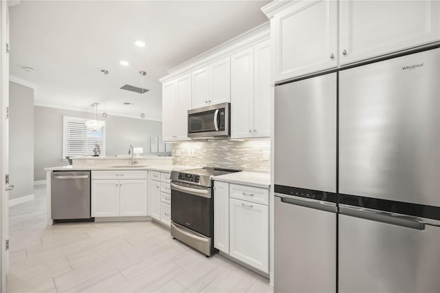 13867 Vadini St, Venice, FL 34293 - kitchen featuring tasteful backsplash, light countertops, white cabinets, appliances with stainless steel finishes, and a sink
