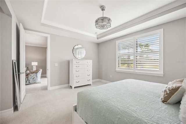13867 Vadini St, Venice, FL 34293 - bedroom featuring ornamental molding, a tray ceiling, baseboards, and light colored carpet