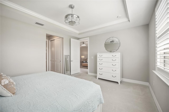 13867 Vadini St, Venice, FL 34293 - bedroom featuring visible vents, baseboards, a raised ceiling, ornamental molding, and light colored carpet
