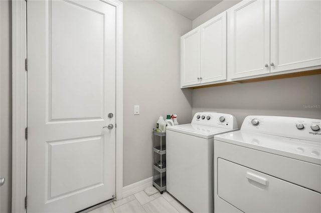 13867 Vadini St, Venice, FL 34293 - washroom with baseboards, cabinet space, and washer and clothes dryer