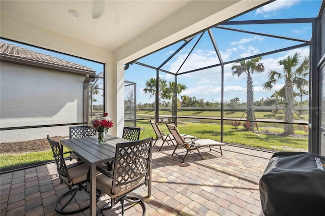 13867 Vadini St, Venice, FL 34293 - exterior space featuring a water view, outdoor dining space, a grill, and glass enclosure