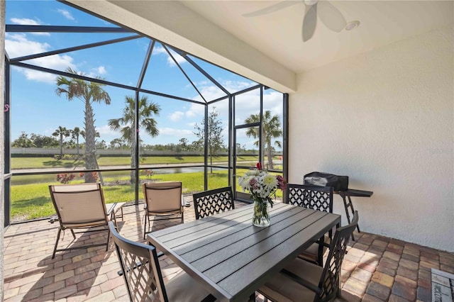 13867 Vadini St, Venice, FL 34293 - sunroom / solarium with a water view, plenty of natural light, a ceiling fan, and outdoor dining space