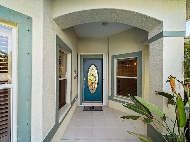 doorway to property with stucco siding