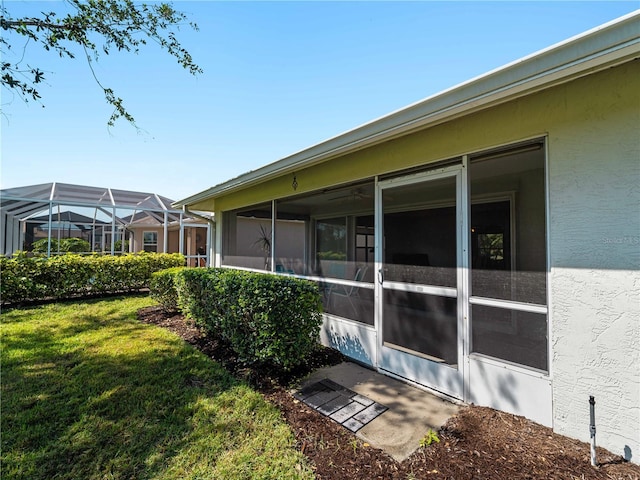 view of property exterior with a yard and stucco siding