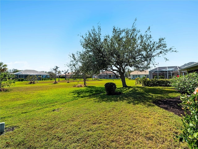 view of yard featuring glass enclosure