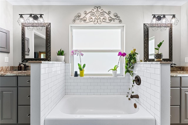 full bathroom with a bath and vanity