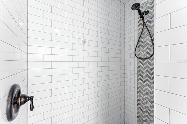 full bathroom with tiled shower