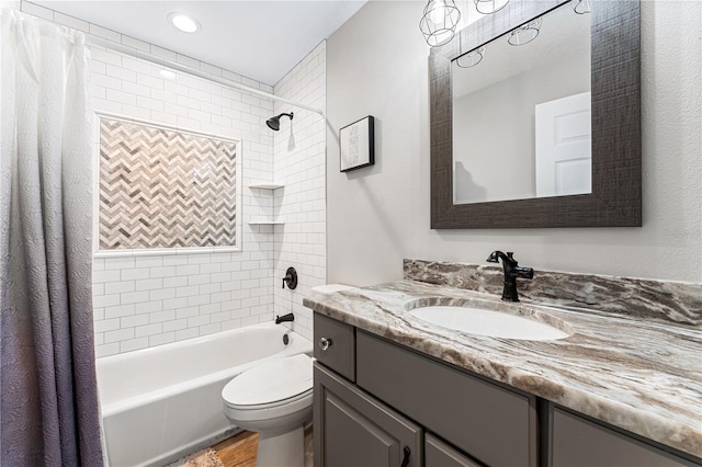 full bathroom with vanity, toilet, and shower / bath combo with shower curtain