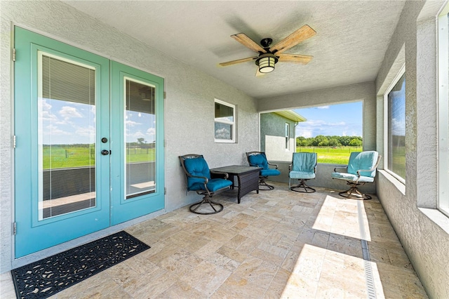 sunroom / solarium with ceiling fan