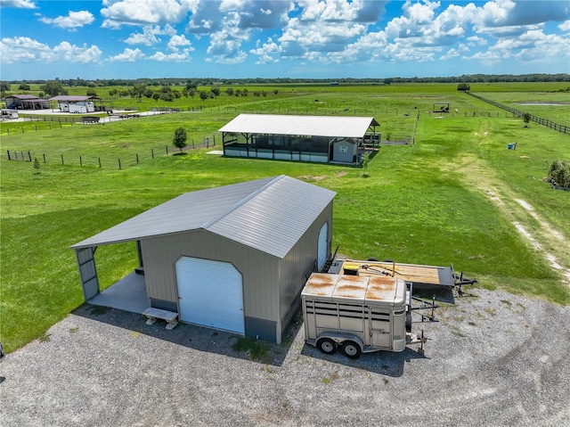 birds eye view of property with a rural view