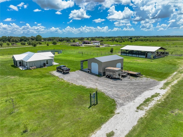 birds eye view of property featuring a rural view