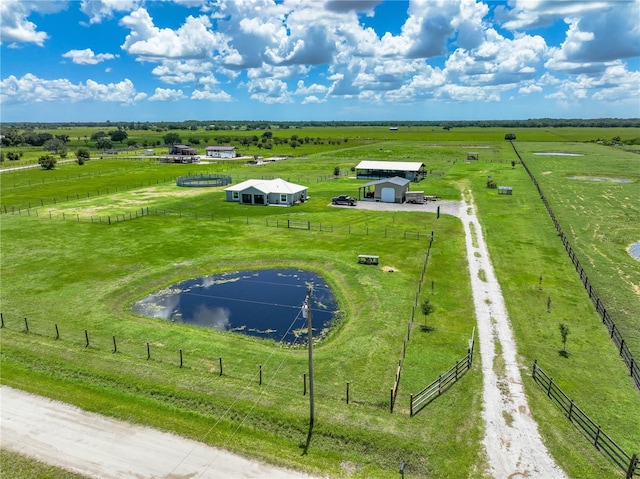 drone / aerial view with a water view and a rural view