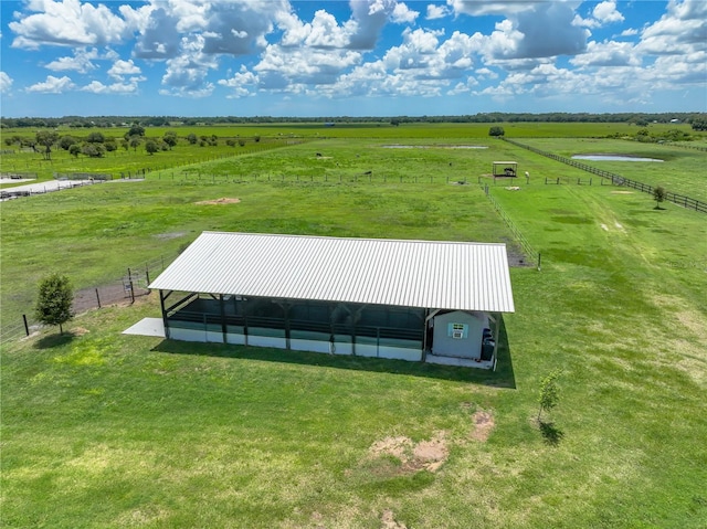 birds eye view of property with a rural view