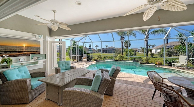 outdoor pool with a ceiling fan, a residential view, glass enclosure, and a patio