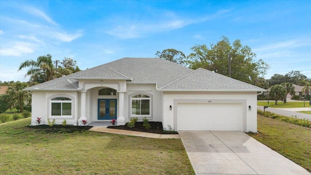 view of front facade featuring french doors, a shingled roof, concrete driveway, an attached garage, and a front yard