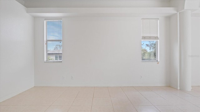 spare room with light tile patterned flooring