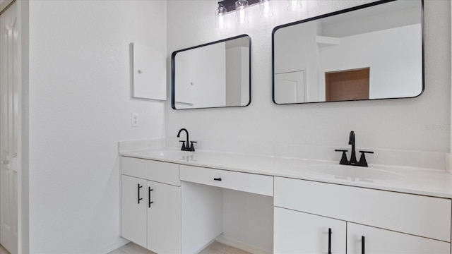 full bath with a sink and double vanity