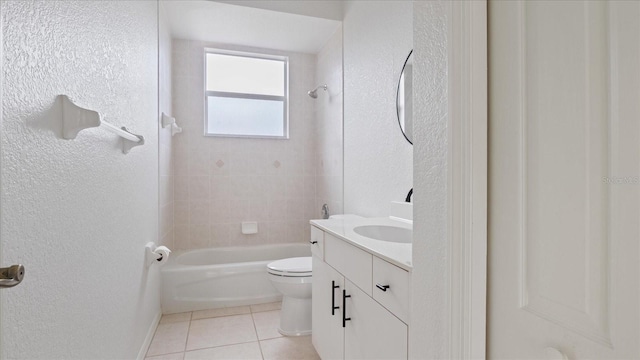 full bath featuring a textured wall, toilet, washtub / shower combination, vanity, and tile patterned floors