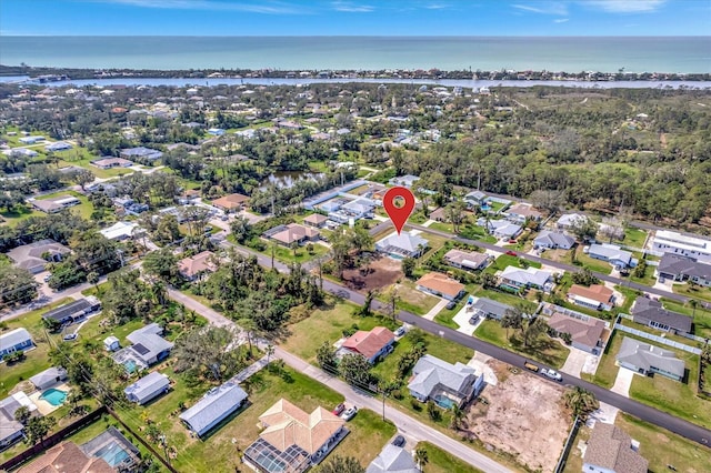 bird's eye view with a water view and a residential view