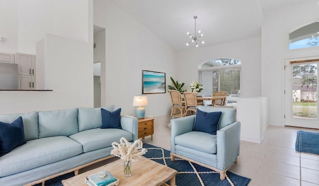 living room with high vaulted ceiling, a notable chandelier, and light tile patterned flooring