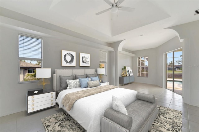 bedroom featuring access to outside, visible vents, light tile patterned flooring, and arched walkways