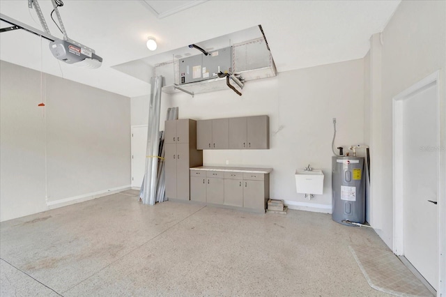 garage featuring a garage door opener, electric water heater, and a sink