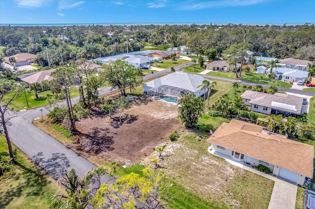 birds eye view of property with a residential view