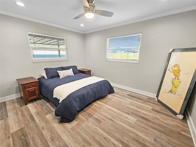 bedroom featuring light wood-style floors, baseboards, crown molding, and recessed lighting