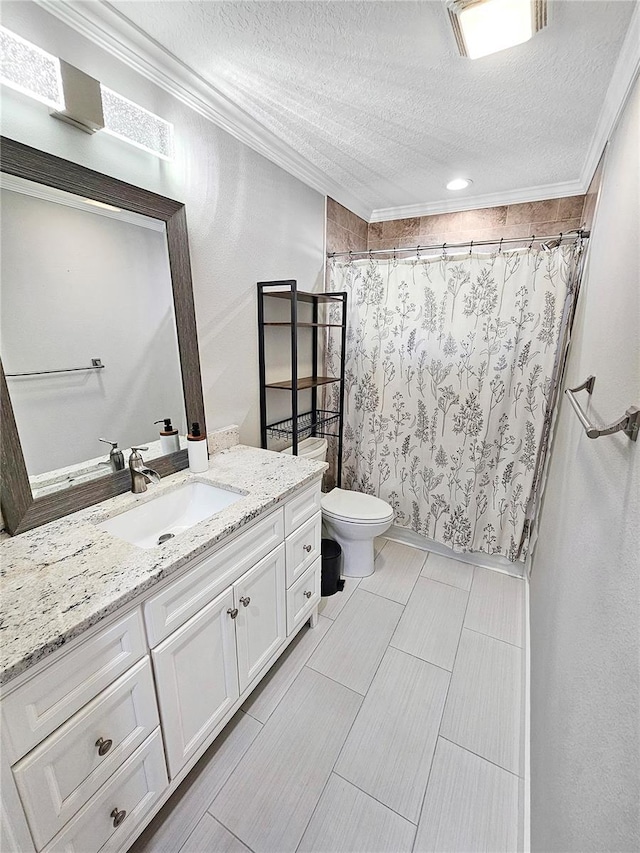 full bathroom featuring toilet, a shower with curtain, ornamental molding, a textured ceiling, and vanity