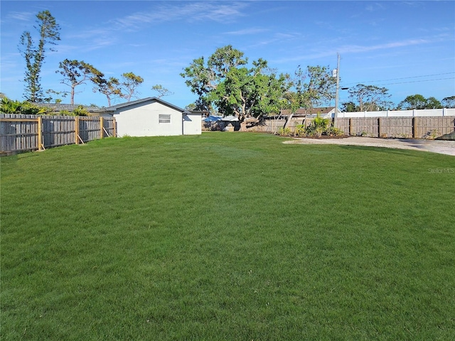 view of yard with a fenced backyard