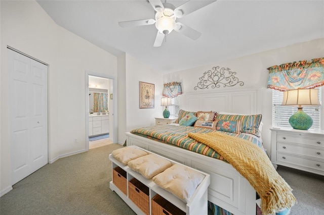 carpeted bedroom featuring lofted ceiling, ceiling fan, and connected bathroom