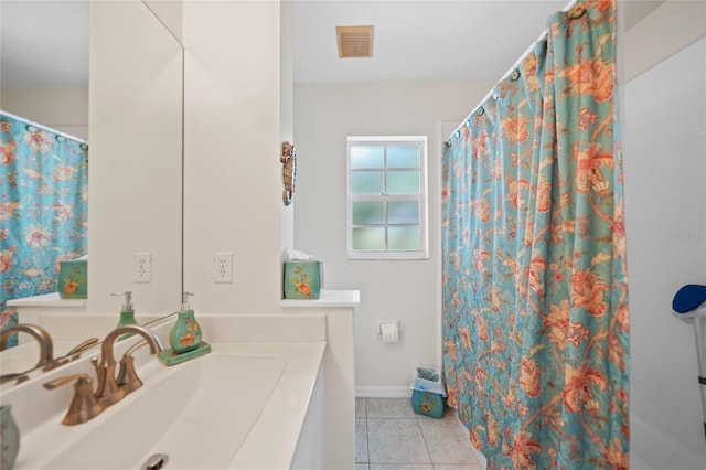 full bath with baseboards, vanity, visible vents, and tile patterned floors