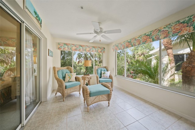 sunroom featuring a ceiling fan