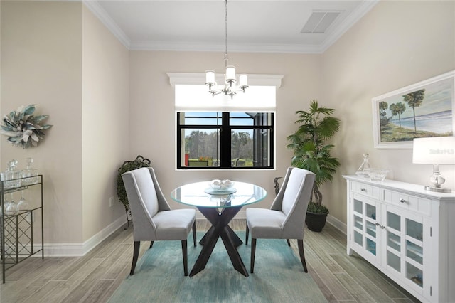 dining space with wood tiled floor, visible vents, and baseboards