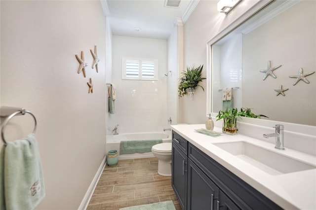 full bathroom with toilet, ornamental molding,  shower combination, wood tiled floor, and vanity