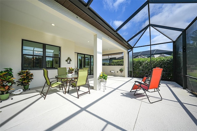 view of patio / terrace with a lanai