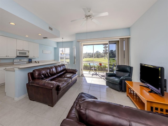 living area with recessed lighting, visible vents, ceiling fan, and light tile patterned floors