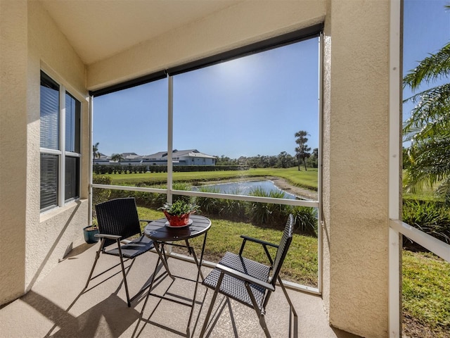 sunroom with a water view