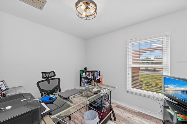 office featuring wood finished floors and baseboards