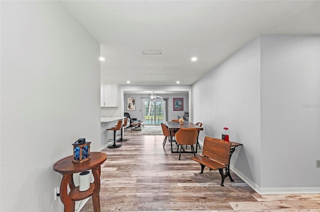 sitting room with visible vents, baseboards, a ceiling fan, light wood-style floors, and recessed lighting