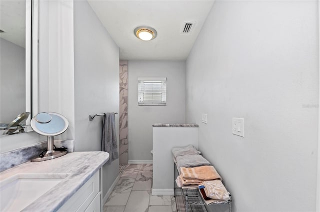 full bath featuring marble finish floor, visible vents, vanity, and baseboards