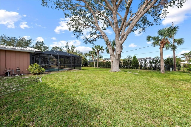 view of yard with a lanai and an outdoor pool