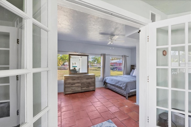 bedroom with visible vents and a textured ceiling