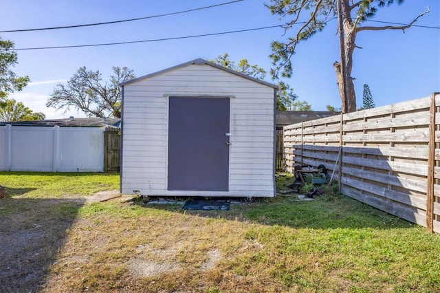 view of shed featuring a fenced backyard