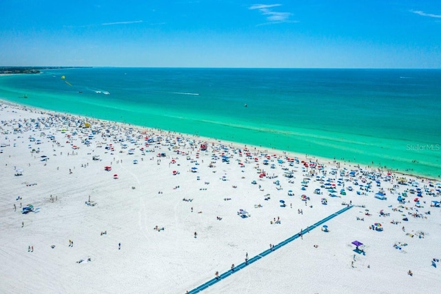 drone / aerial view with a view of the beach and a water view