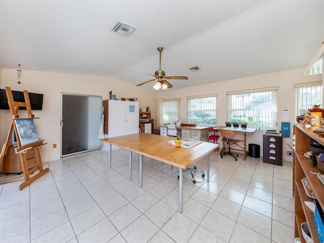 dining room with lofted ceiling, light tile patterned floors, visible vents, and a ceiling fan