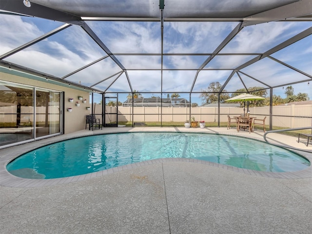 view of pool featuring a lanai, a patio area, a fenced backyard, and a fenced in pool